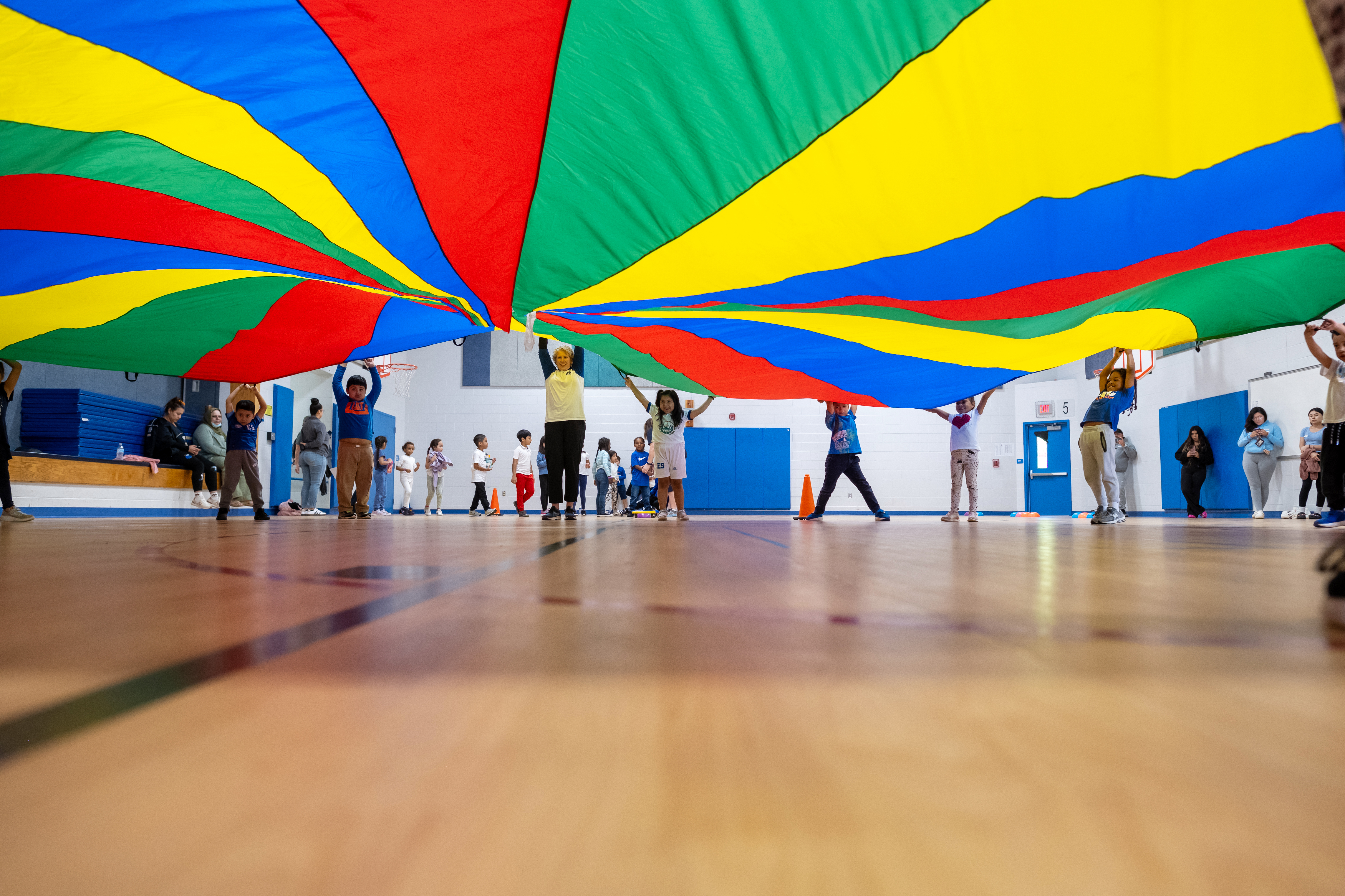 kids playing with a parachute