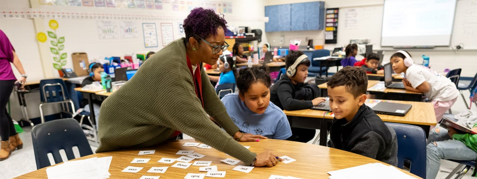 teacher helping student